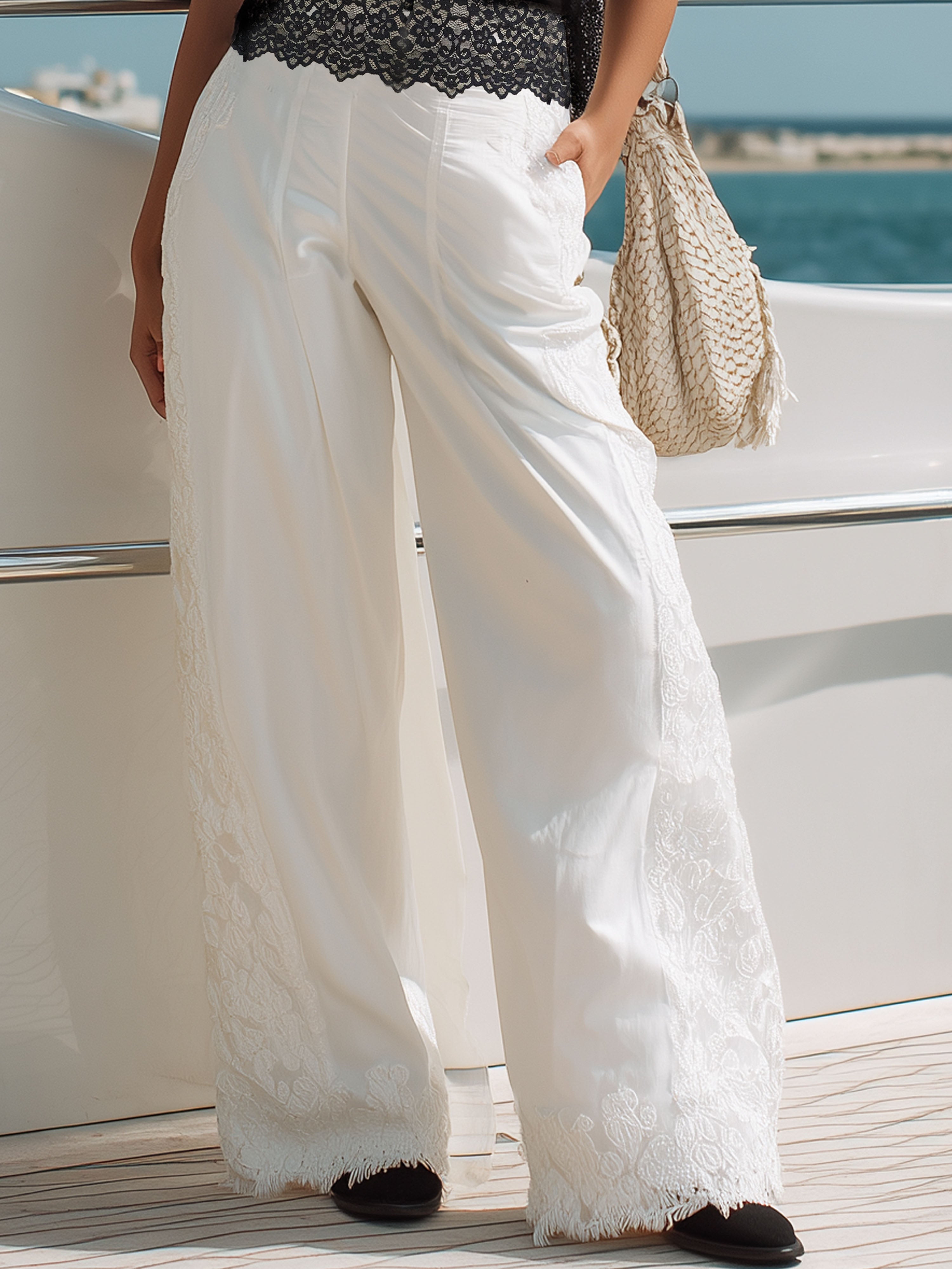 Elegant Vacation-Style Black Lace-Trimmed Top And White Trousers Set